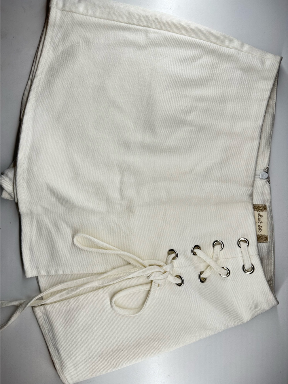 Altar'd State Cream Lace-Up Mini Skirt with Silver Eyelets